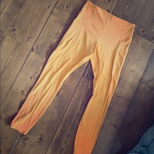 Athleta Powervita stash Pocket Salutation Tight